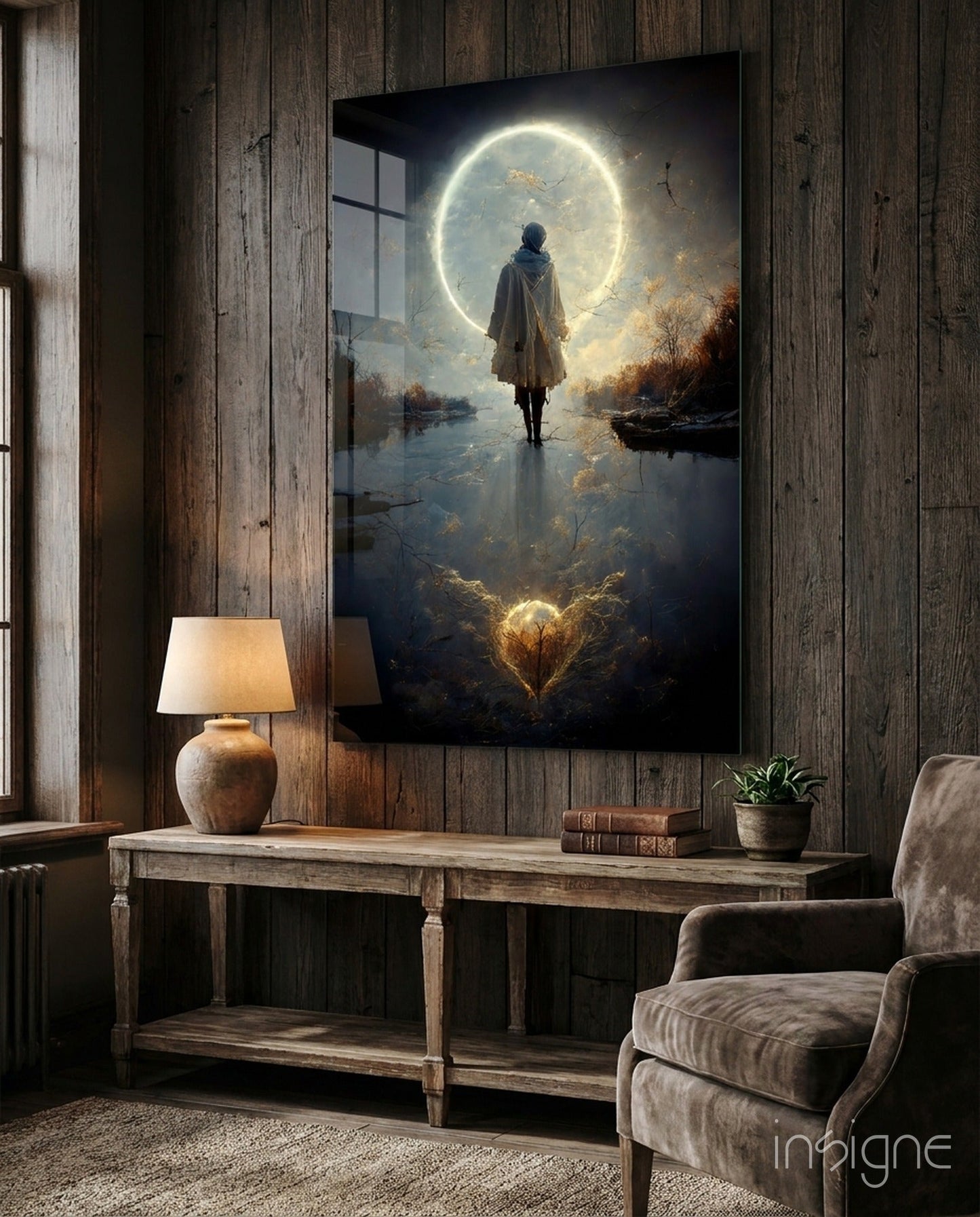 Framed glass wall art depicting a solitary figure standing before a large glowing moon above a misty landscape, displayed in a rustic wooden interior.