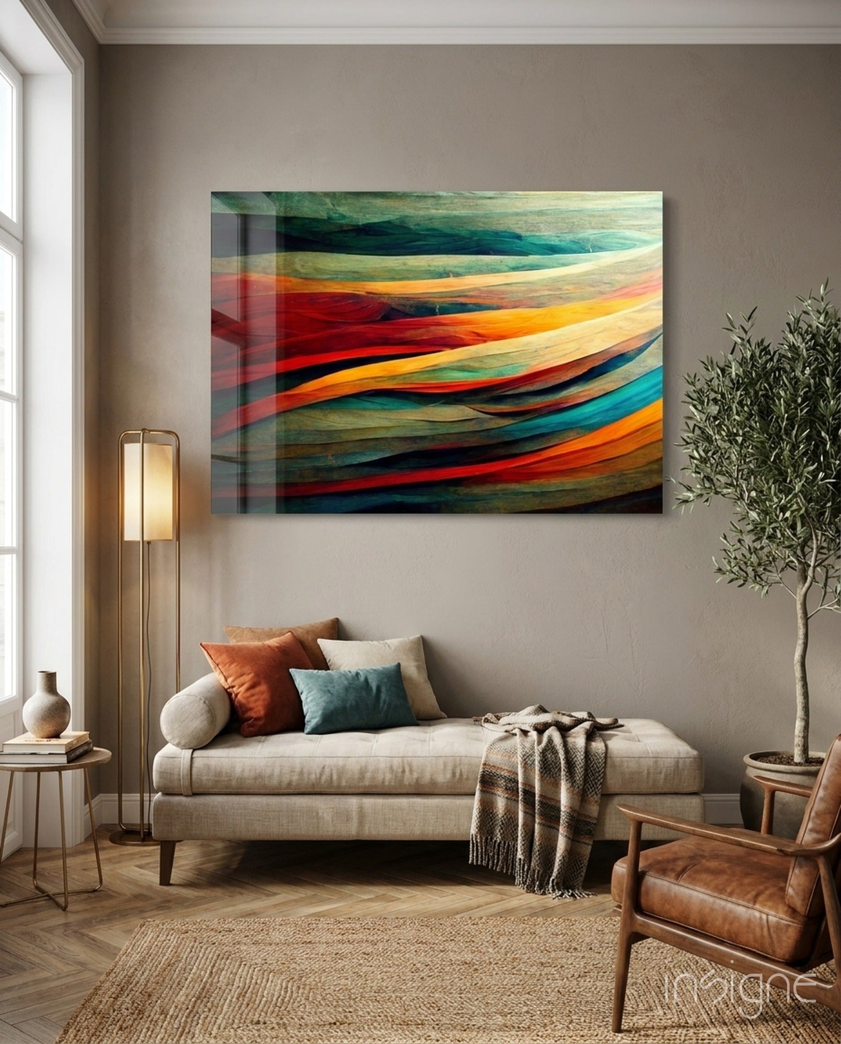 Colorful glass art panel with layered red, orange, teal, and green curved stripes hanging above a cream sofa in a modern living room.