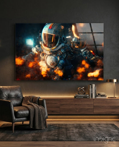 Two astronauts in spacesuits surrounded by orange flames displayed as glass wall art above a wooden media console in a modern living room.