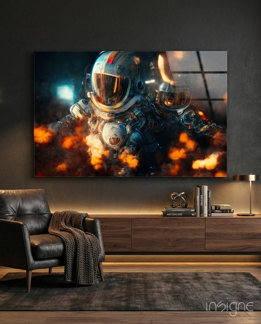 Two astronauts in spacesuits surrounded by orange flames displayed as glass wall art above a wooden media console in a modern living room.