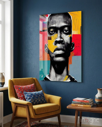 Modern living room featuring colorful pop art portrait with black and white face, yellow, red, and teal geometric shapes on blue wall above mustard chair.