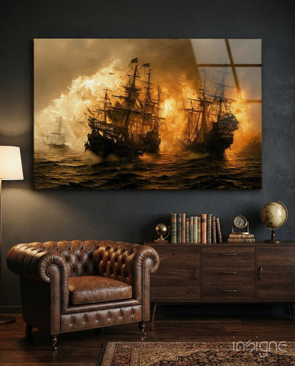 Red Storm Glass Wall Art displaying dramatic naval battle scene with burning ships, hung above leather Chesterfield chair in study room setting.