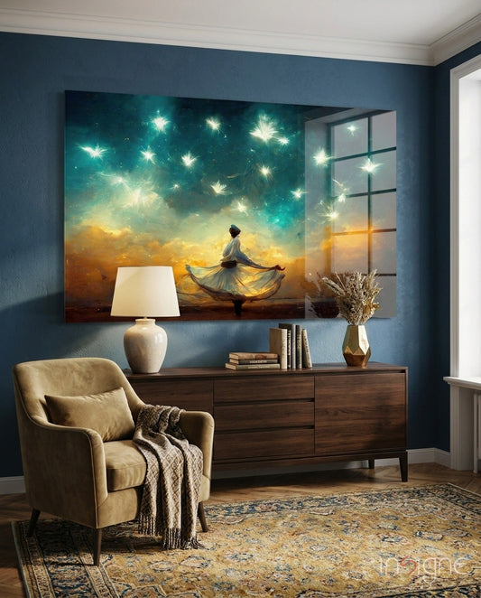 Glass wall art depicting a figure in flowing dress against a starry teal and golden sunset sky, displayed above a wooden dresser in a blue room.