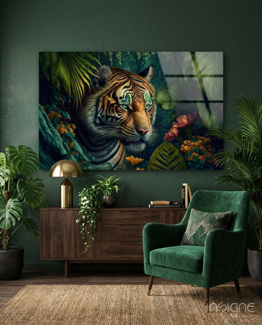 Tiger with striking green eyes surrounded by tropical foliage and flowers displayed as glass wall art above wooden furniture in green interior.