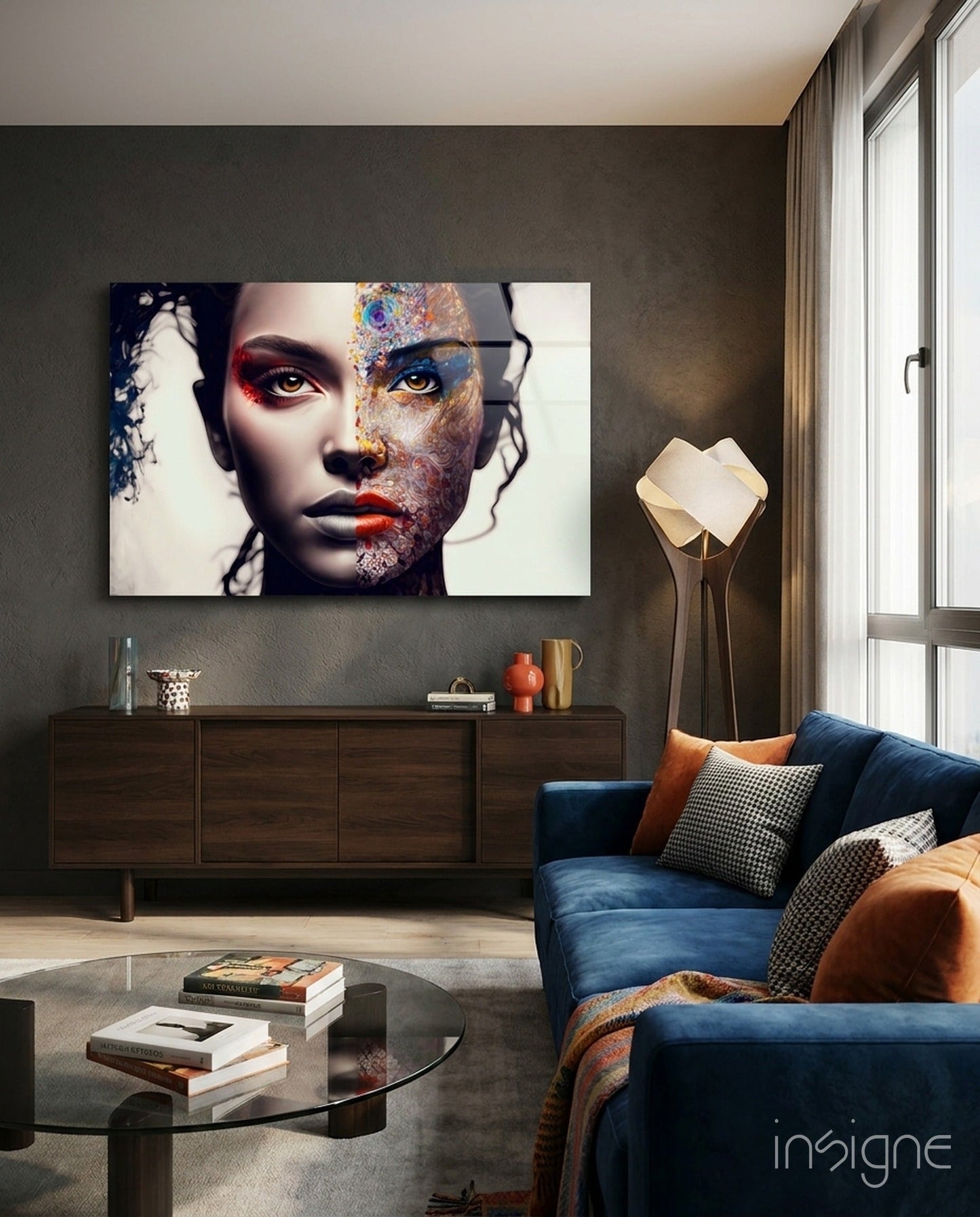 Modern living room interior with abstract multi-colored face glass wall art mounted above dark wood credenza.