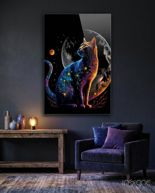 Glowing cosmic cat artwork displayed on dark wall above wooden console table with decorative vessels and lit lamp, blue velvet chair below.