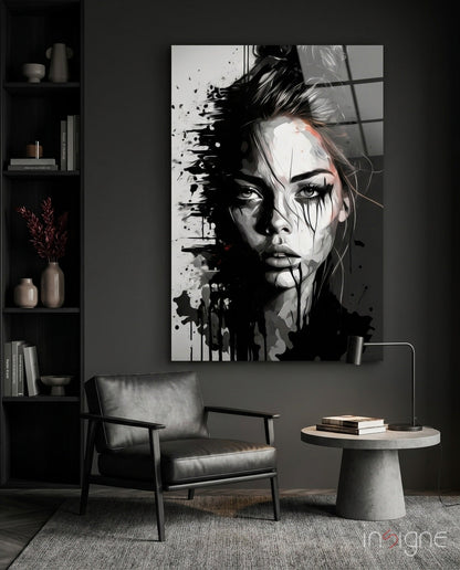 Modern living room interior featuring a large black and white abstract portrait glass wall art above a leather chair.