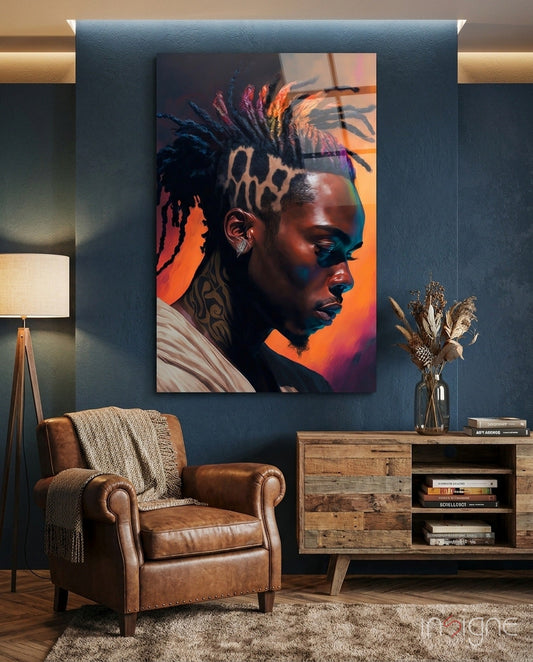 Portrait glass wall art depicting a profile of a man with leopard print hair and colorful orange-to-blue gradient lighting, displayed in a modern living room setting.