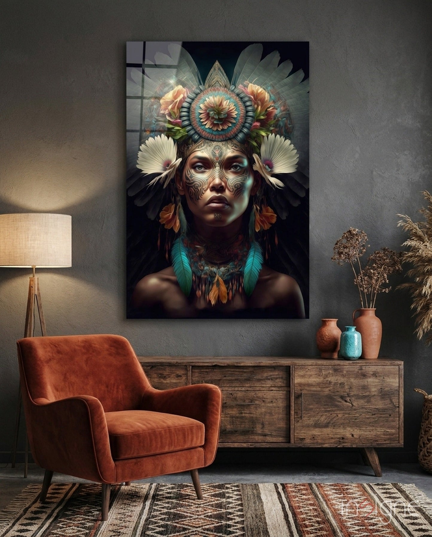 Glass wall art depicting a woman with ornate facial tattoos and a elaborate floral headdress displayed above a wooden dresser in a styled interior.