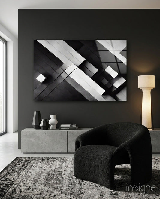 Modern living room with black and white geometric glass wall art above concrete console table, styled with sculptural decor.