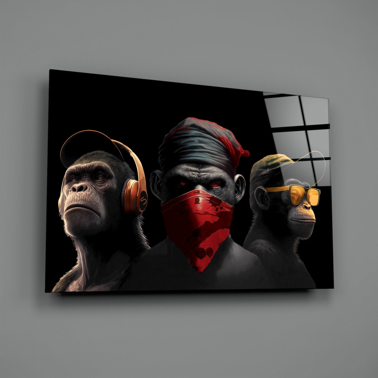 Three stylized monkeys wearing headphones, a red bandana, and sunglasses displayed on black glass wall art against gray background.