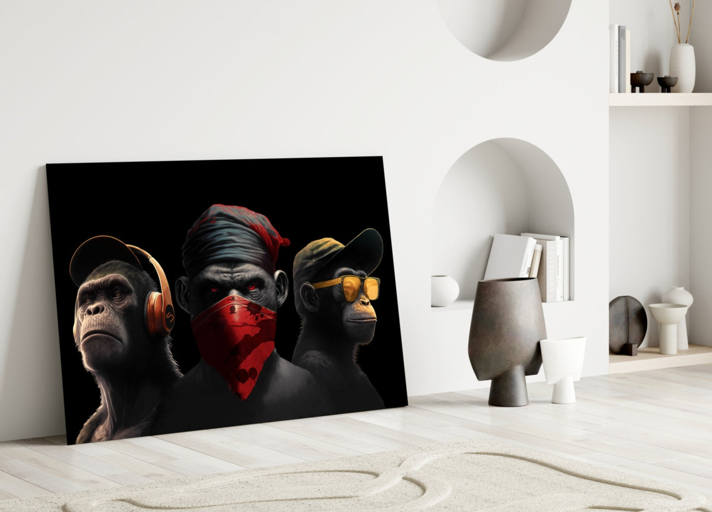 Three stylized black chimpanzees with red, gold, and orange accents wearing headphones, blindfold, and sunglasses leaning against white interior wall.