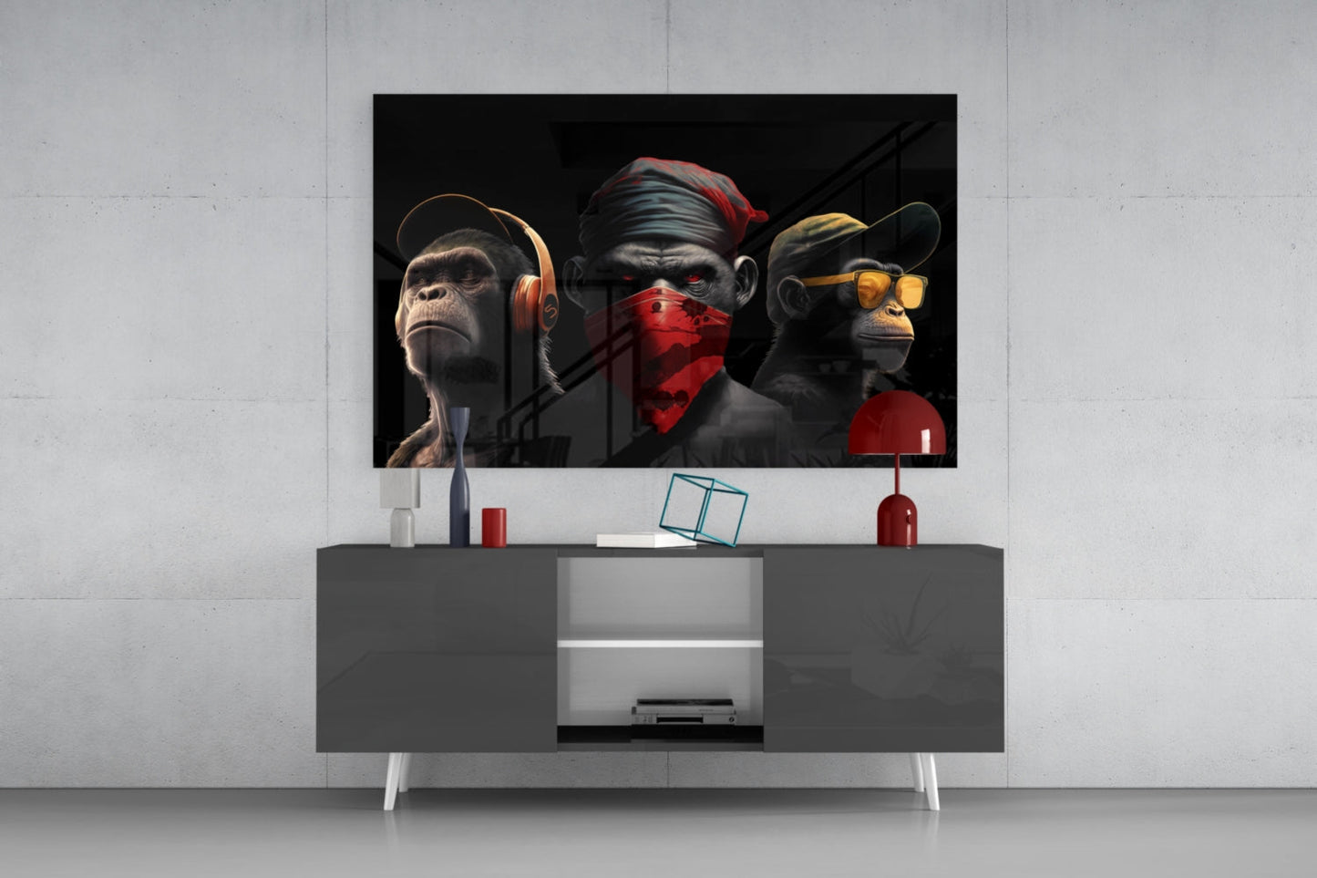 Three stylized monkeys wearing headphones, blindfold, and sunglasses displayed on a dark TV stand in a modern living room setting.