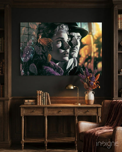 Glass wall art depicting two vintage-style faces with autumn foliage and warm lighting, displayed above a wooden desk in a dark interior.
