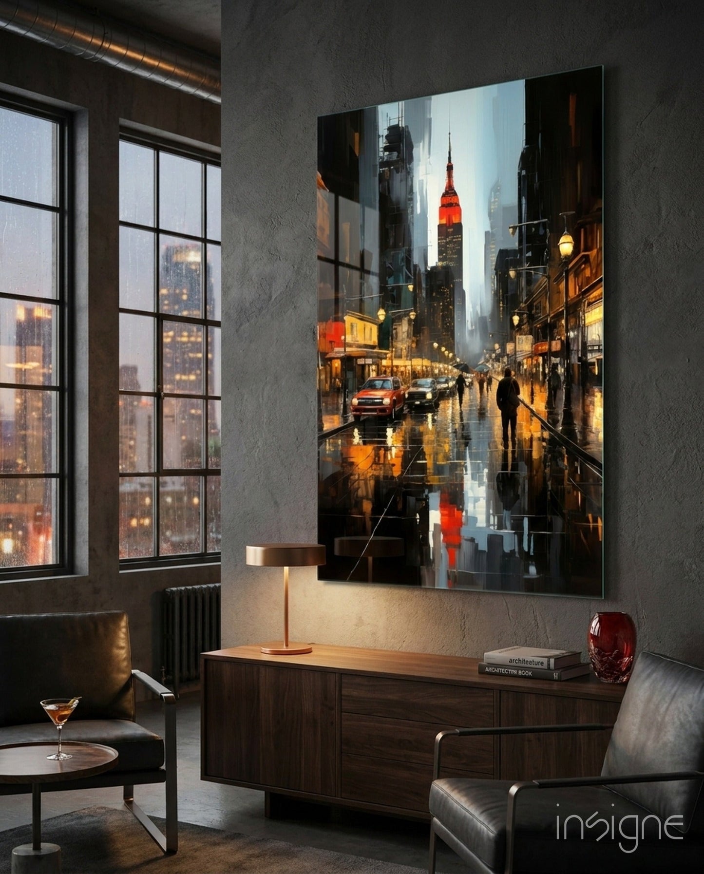 Modern loft interior featuring large illuminated glass wall art of rainy New York City street with Chrysler Building, displayed above wooden dresser.