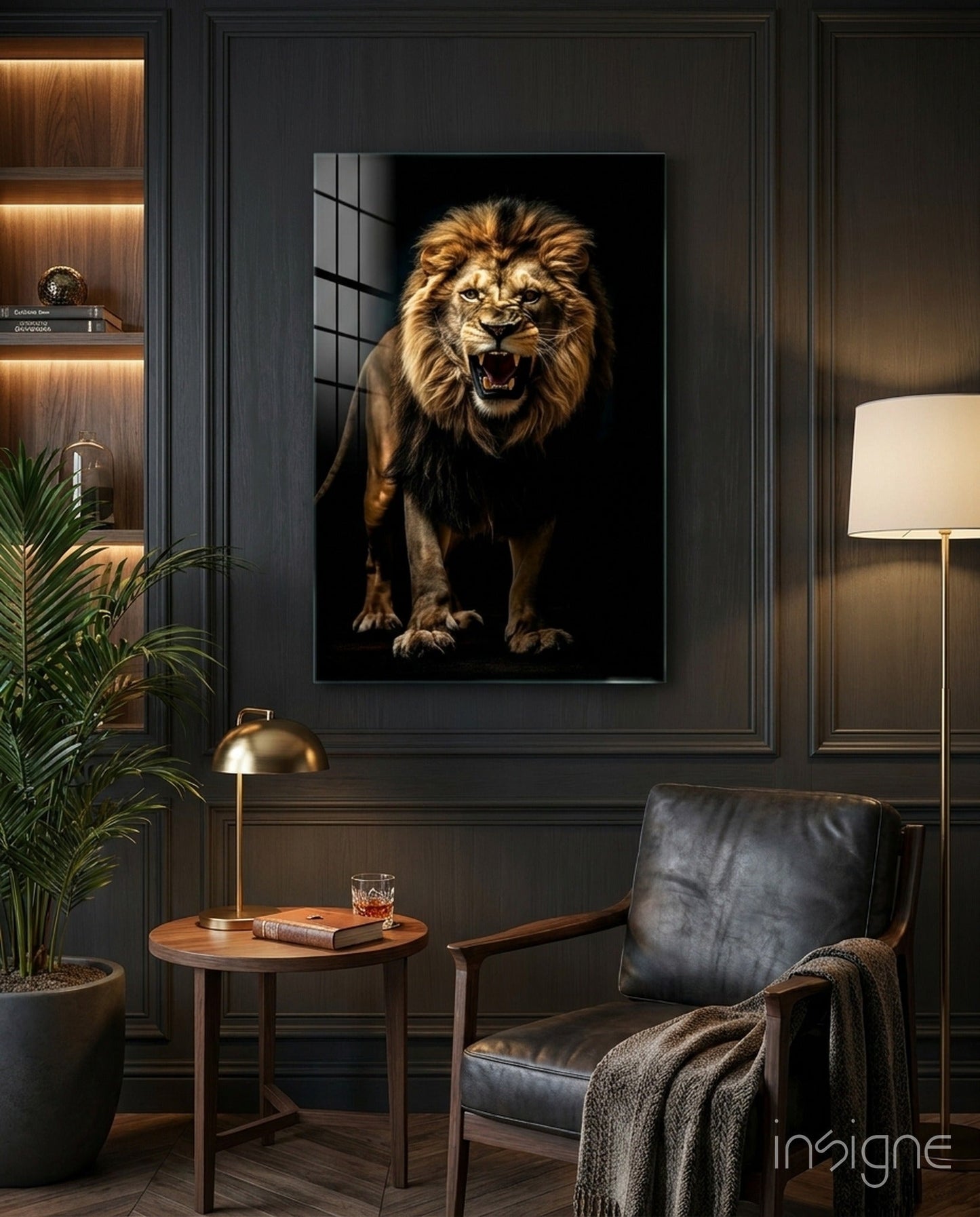 Framed lion portrait with golden mane roaring against black background, displayed on dark paneled wall above wooden side table in modern interior setting.