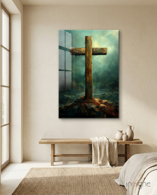 Rustic wooden cross with weathered brown tones displayed on bedroom wall above wooden bench, misty teal background visible through glass effect.