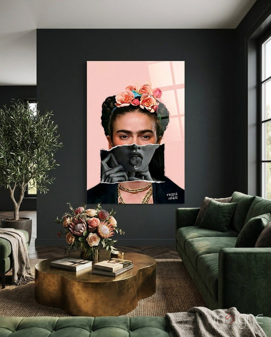 Contemporary floral crown portrait glass wall art displayed on black wall above brass table in modern living room with green seating.