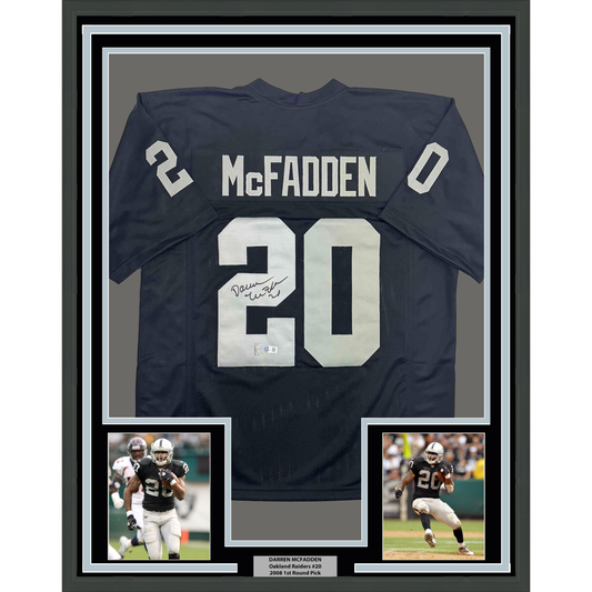 Framed dark blue Oakland Raiders jersey number 20 with "McFadden" nameplate and autograph, flanked by two action photos below.