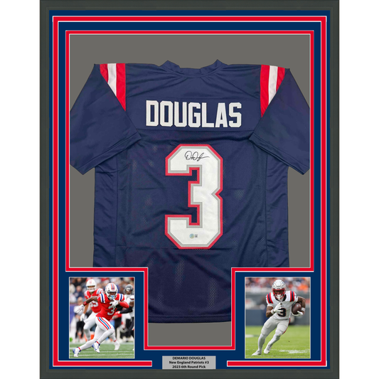 Framed navy New England Patriots jersey number 3 signed by DeMario Douglas, displayed with red and white borders and two action photos below.