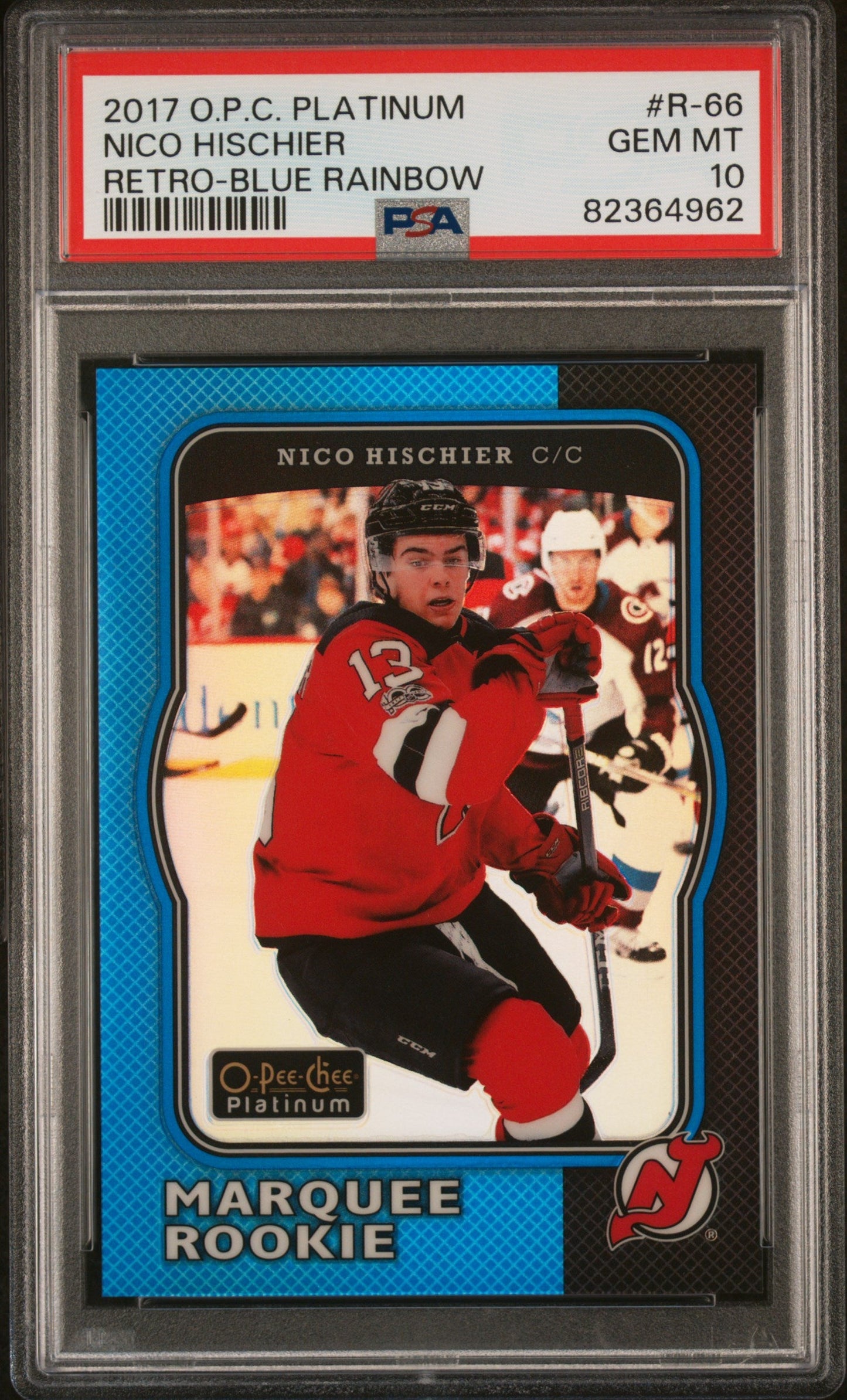 PSA-graded trading card in plastic case showing Nico Hischier in red New Jersey Devils jersey, blue-bordered card front with "Marquee Rookie" text visible.