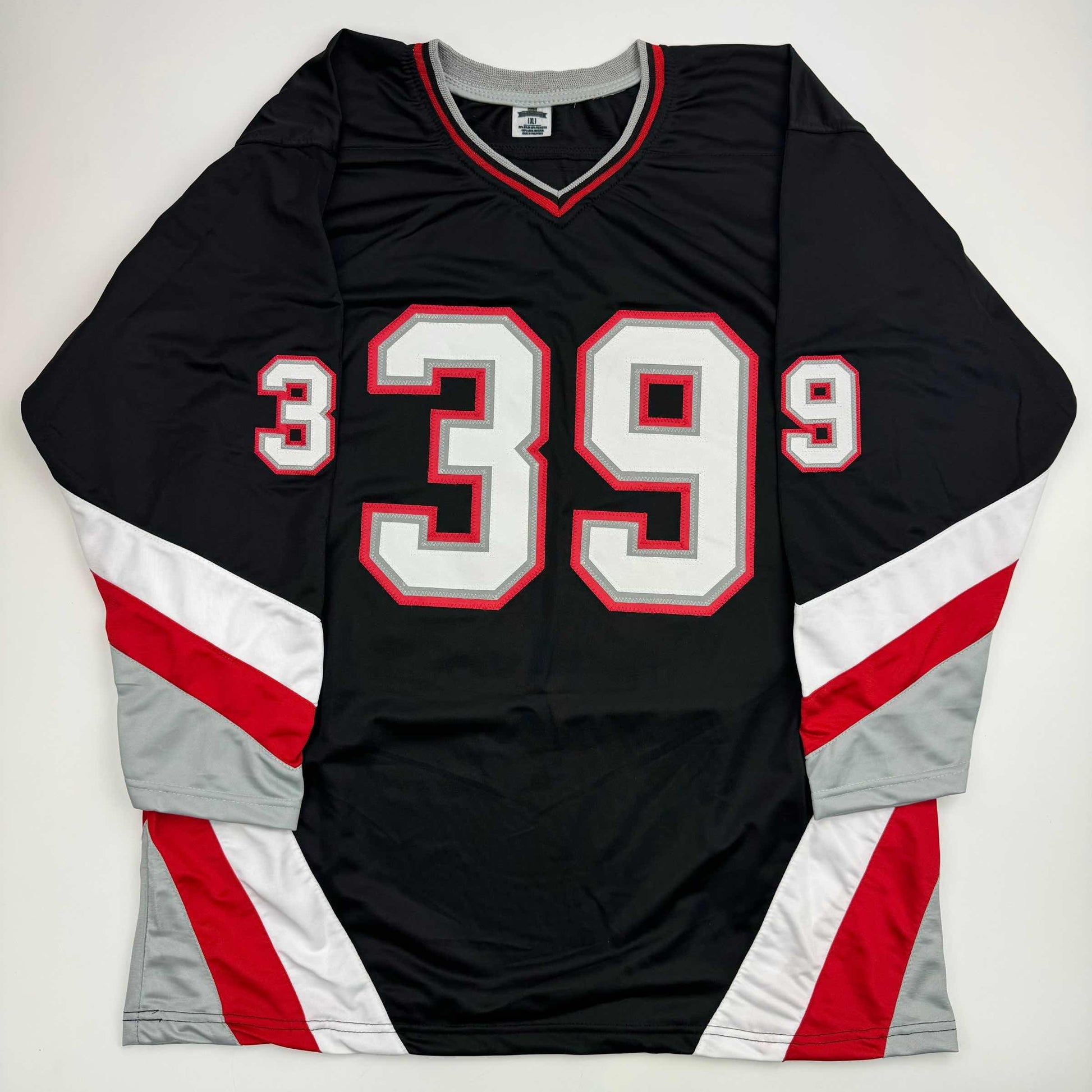 Black hockey jersey with red and white trim displaying number 39 on front, laid flat against white background.