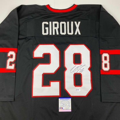 Back view of black hockey jersey with red and white number 28, "GIROUX" nameplate, red neckline, and PSA authentication certificate visible at bottom.