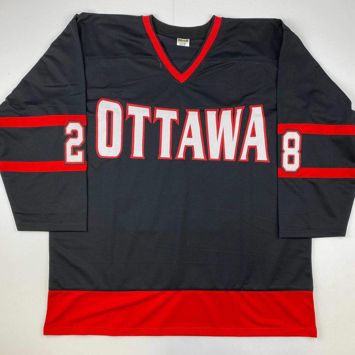 Black and red Ottawa hockey jersey with white "OTTAWA" text and numbers "2" and "8" on sleeves, displayed flat on white background.