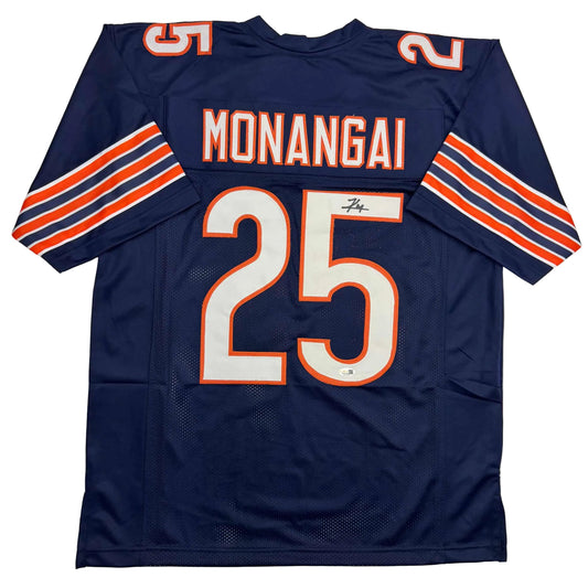 Navy blue football jersey with orange and white striped sleeves, displaying "MONANGAI" and number 25 on back.