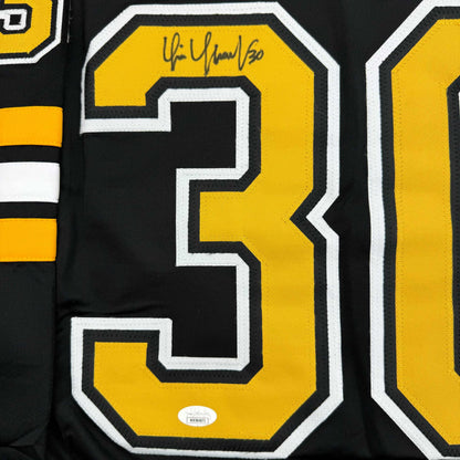 Close-up of signed number 3 on yellow and black Boston Bruins hockey jersey with JSA authentication sticker.