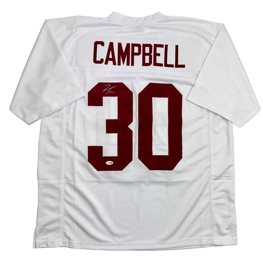 Back view of white Alabama football jersey number 30 with "CAMPBELL" nameplate and autograph on maroon numbers.