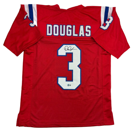 Red Douglas number 3 football jersey displayed flat, showing back with printed name and number, signed in blue ink.