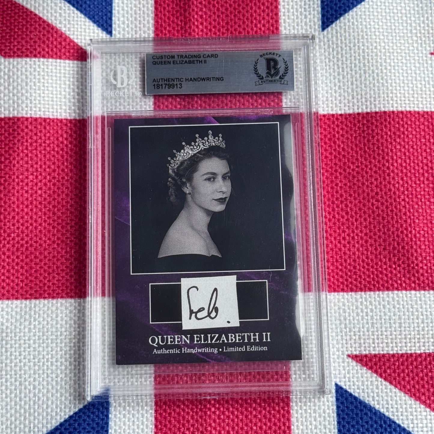 Sealed trading card of Queen Elizabeth II with authentic handwriting signature and tiara portrait, displayed against Union Jack background.