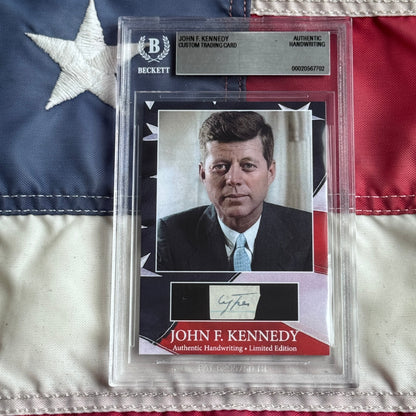 Beckett-authenticated John F. Kennedy trading card with photograph and handwritten signature displayed on American flag background.