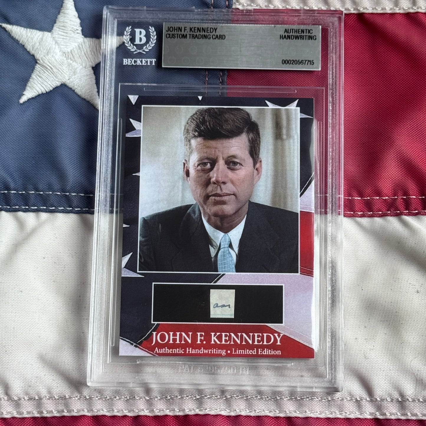 Beckett-graded John F. Kennedy custom trading card with authentic handwriting sample, displayed against American flag background.