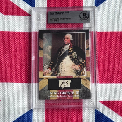 Custom trading card of King George III in military dress uniform with authenticated handwriting signature, displayed in protective plastic case against Union Jack background.