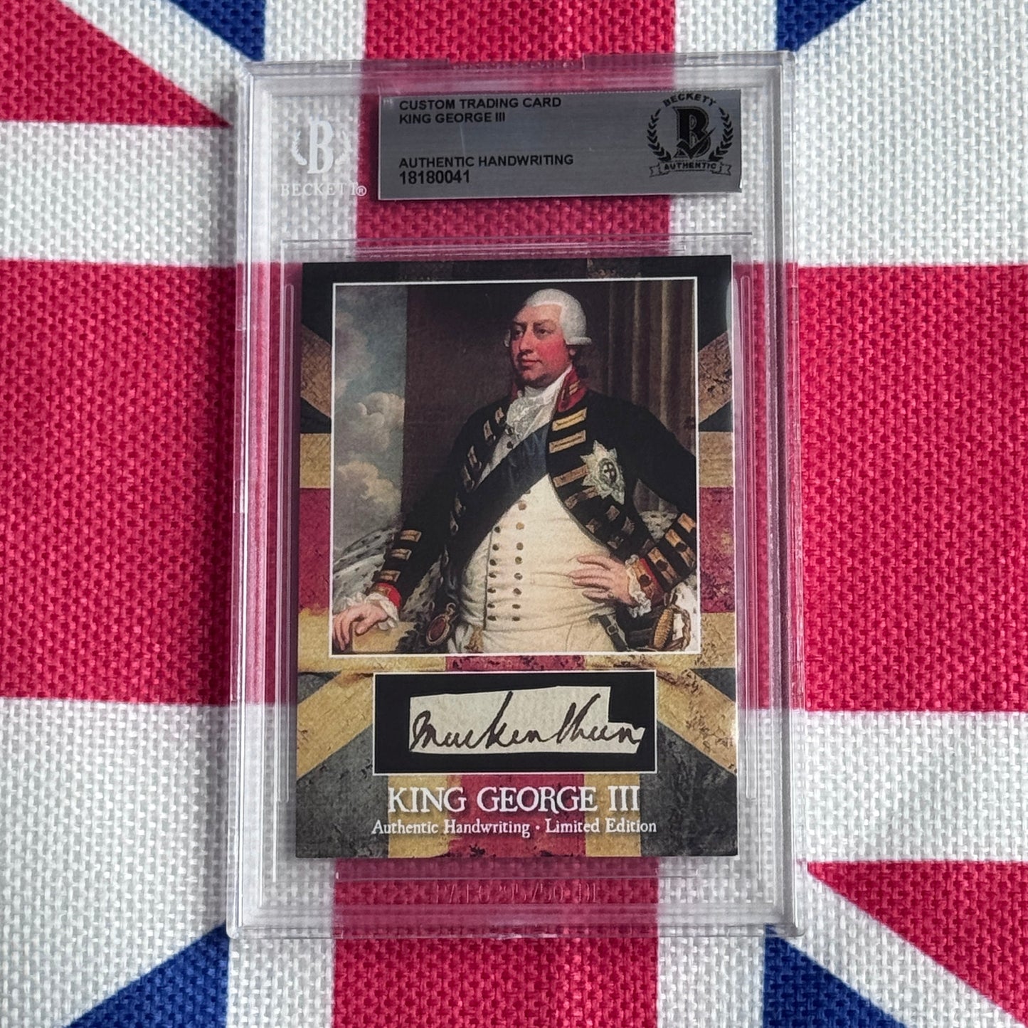 Custom trading card featuring King George III portrait in military dress with authentic handwriting signature, displayed in clear protective case against Union Jack background.
