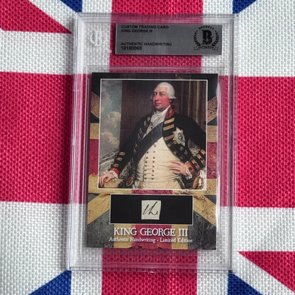 Custom trading card featuring King George III portrait in military dress with authenticated handwriting sample, displayed in clear protective case against Union Jack background.