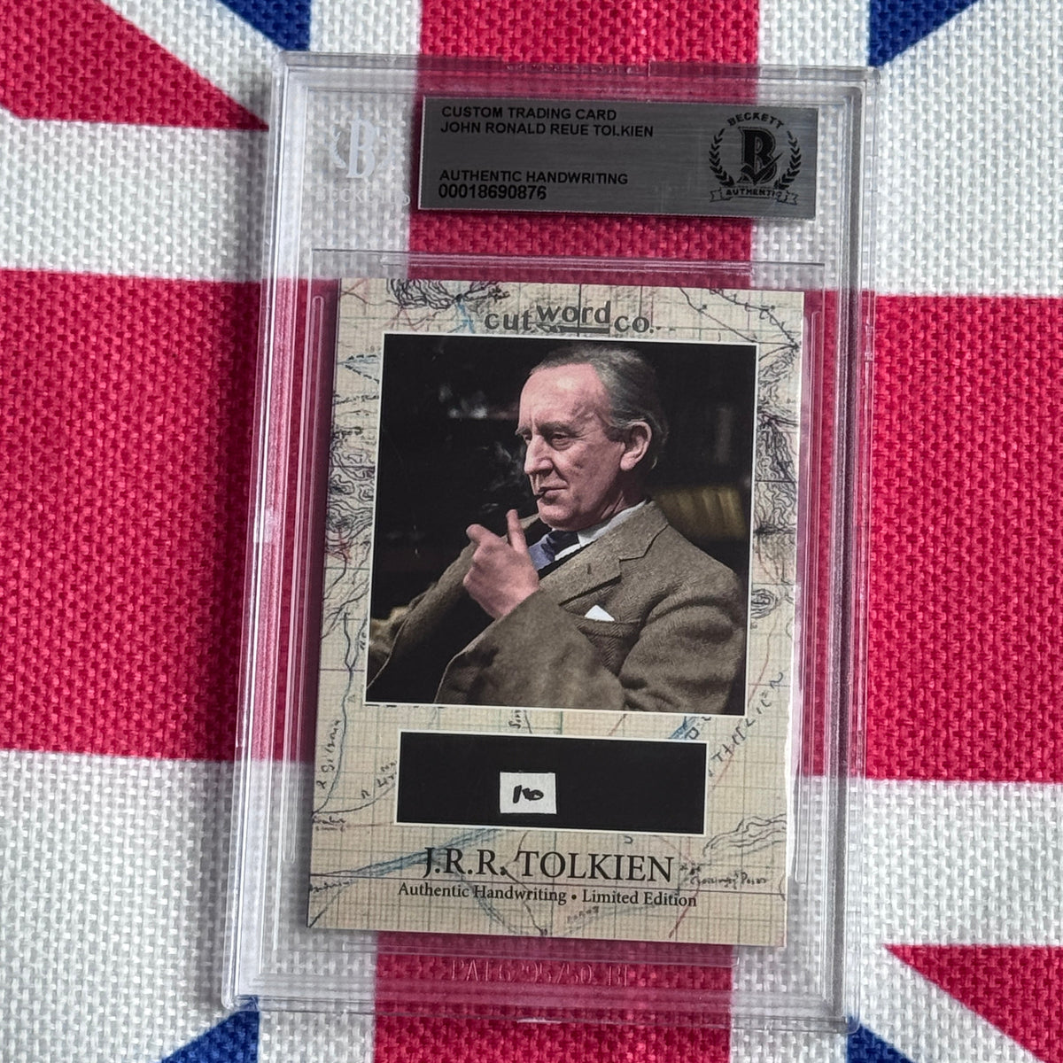 Graded trading card featuring J.R.R. Tolkien photograph and authenticated handwriting sample on map-patterned background.