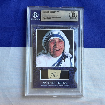 Beckett-graded custom trading card featuring Mother Teresa's photograph with authentic handwriting signature, displayed in clear protective case against blue background.