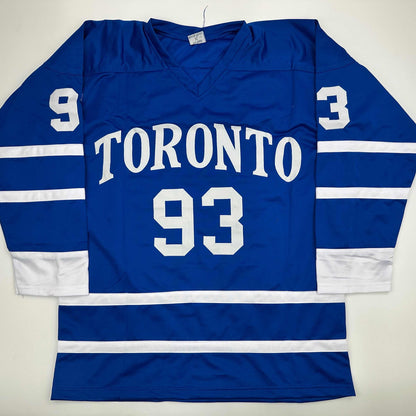 Blue Toronto hockey jersey with white number 93 and "TORONTO" text displayed flat on white background, front view.