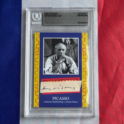 Front view of a Beckett-slabbed blue card with a black-and-white portrait, a cream handwritten signature strip, and printed PICASSO lettering.