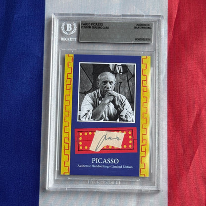 Front of a Beckett-slabbed card: black-and-white portrait, signature on a cream slip, and PICASSO lettering on blue.