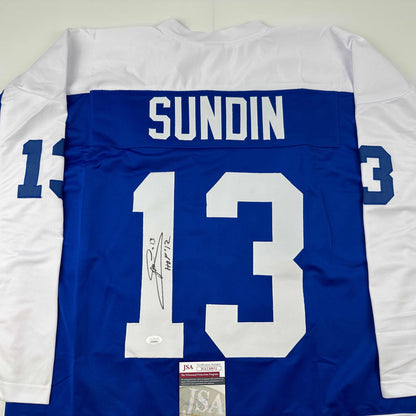 Back view of blue Toronto Blue Jays hockey jersey numbered 13 with "SUNDIN" nameplate and autographed signature, displaying JSA authentication certificate.