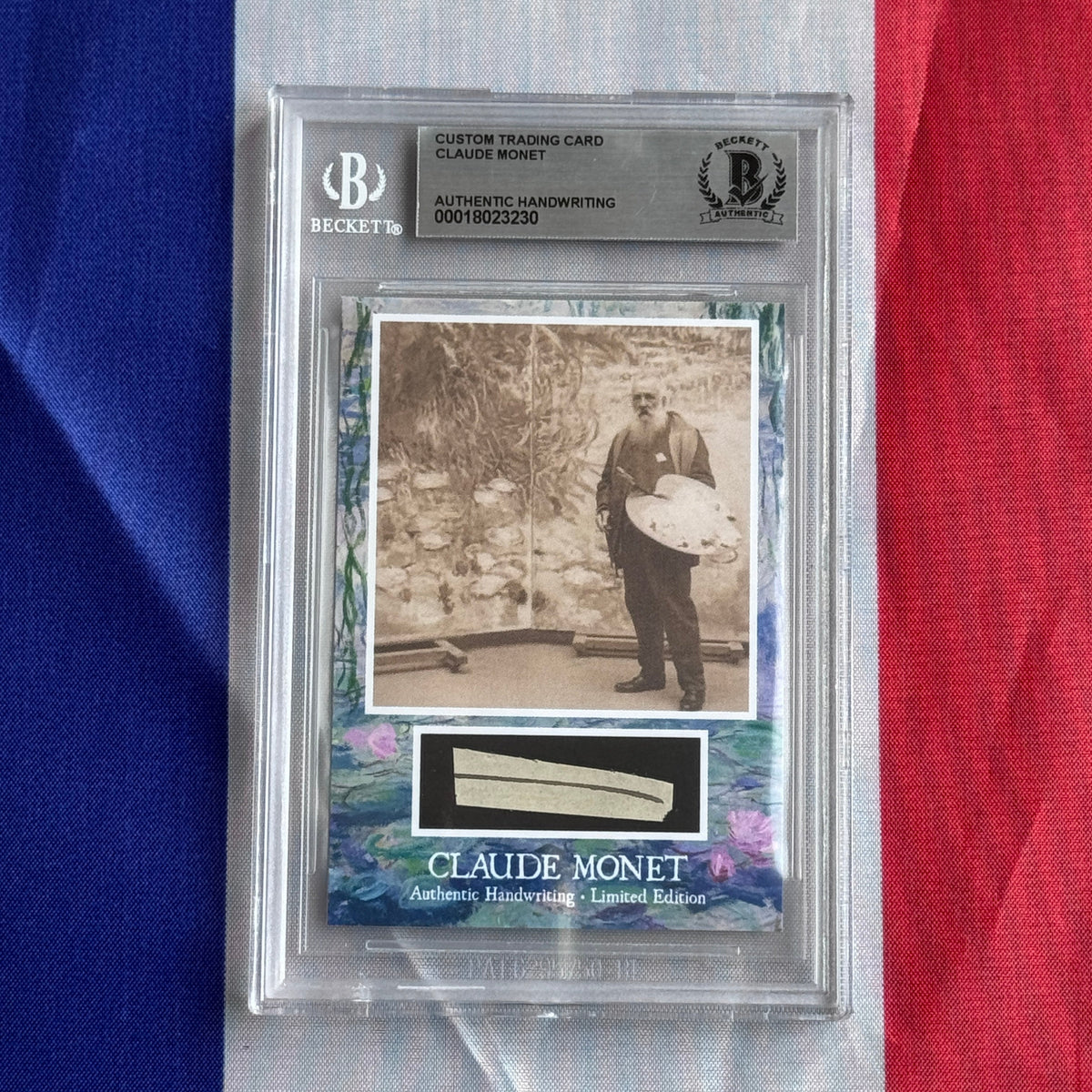 Front view of a sealed Beckett slab showing a sepia photo of a bearded man holding a palette.