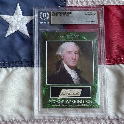 Front view of a sealed Beckett slab holding a green-bordered card with a Washington portrait and a handwriting clipping.