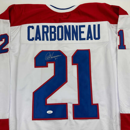 Back view of signed Montreal Canadiens white hockey jersey number 21 with Carbonneau nameplate.