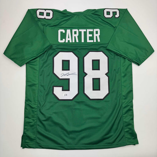 Green Kelly Philadelphia Eagles football jersey #98 with Carter nameplate and autographed number, displayed flat on white background.