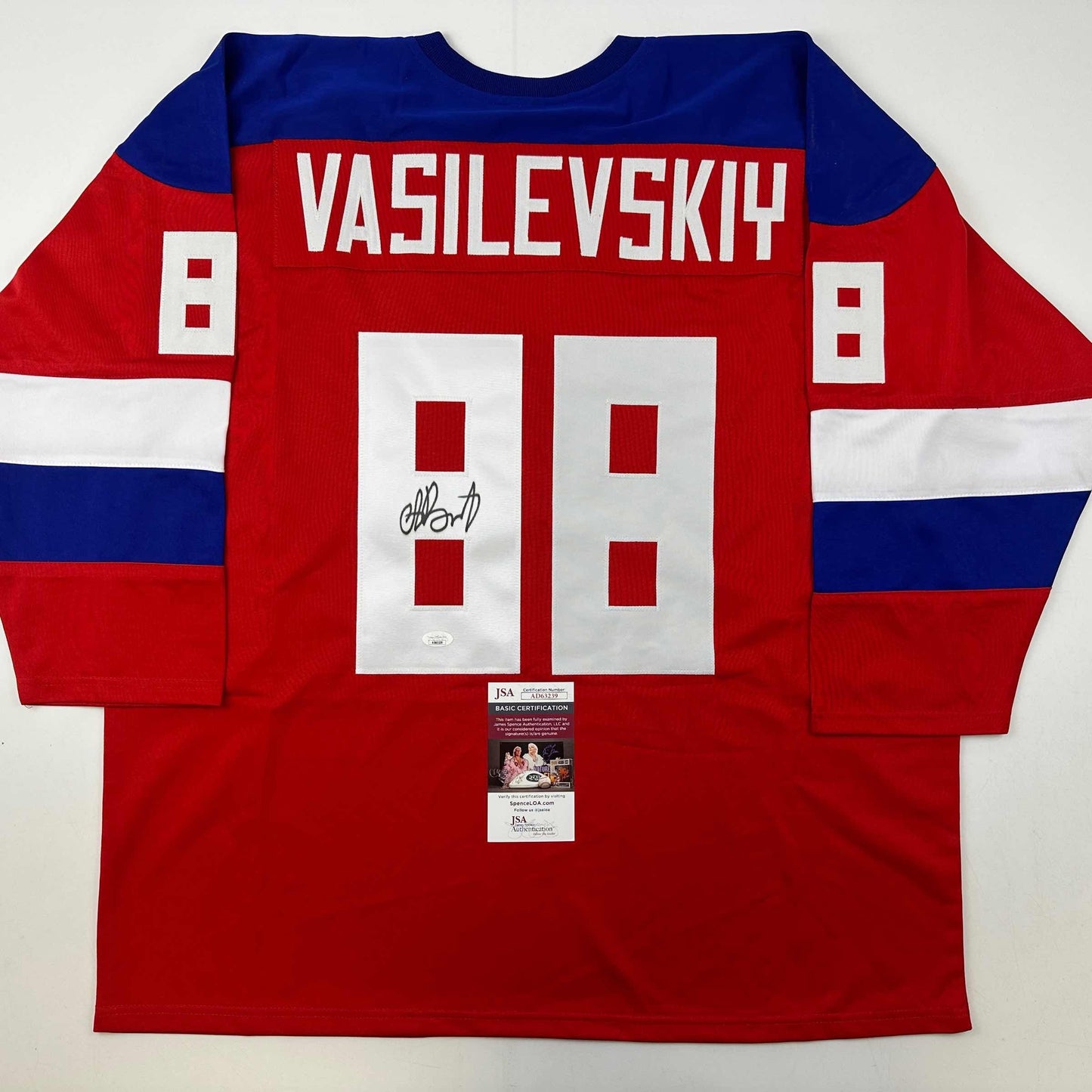 Red Team Russia Olympic hockey jersey with "VASILEVSKIY" and number 88 displayed flat, showing JSA authentication certificate attached at bottom.