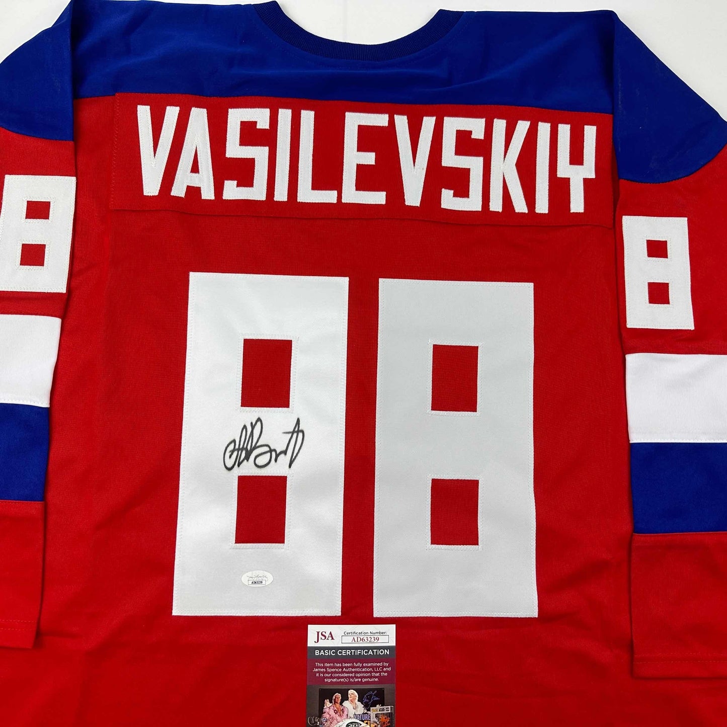 Red hockey jersey with "VASILEVSKIY" and number 88 displayed flat, showing autographed signature and JSA certification label.
